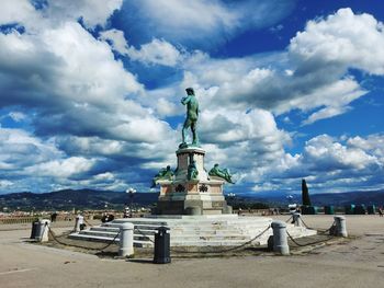 Statue of liberty against cloudy sky