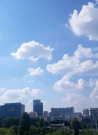 Buildings in city against sky