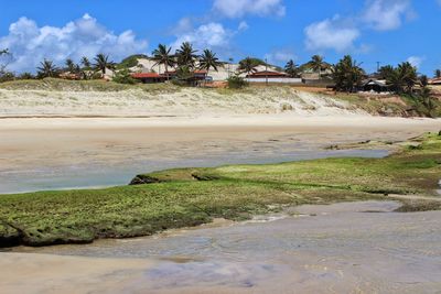 Scenic view of beach against sky