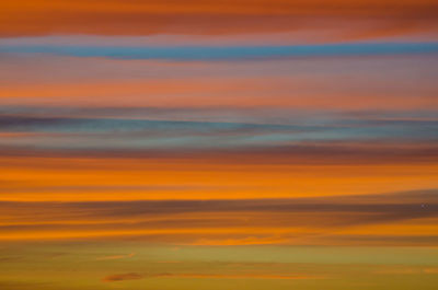 Scenic view of sea against orange sky