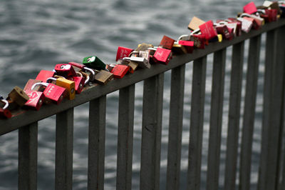 Love locks on fence by river