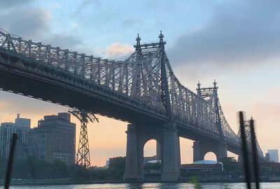 View of suspension bridge against cloudy sky