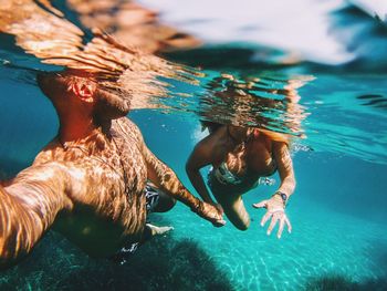 Young woman swimming in pool