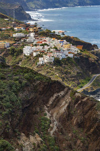 High angle view of townscape by sea