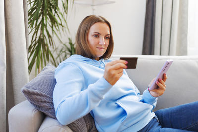 Young woman using mobile phone