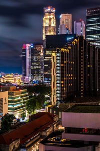 Illuminated buildings in city at night