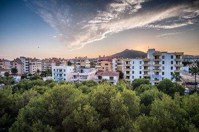 High angle view of trees and buildings against sky