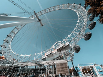 Low angle view of ferris wheel against sky