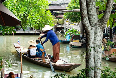 People on boat in river