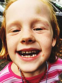 Close-up portrait of smiling girl wearing braces