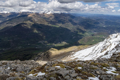 Aerial view of majestic mountains against sky