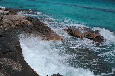 Waves splashing on rocks