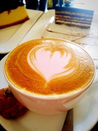 Close-up of cappuccino served on table