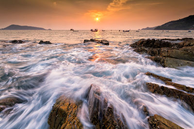 Scenic view of sea against sky during sunset