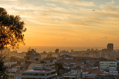 High angle view of townscape against sky during sunset