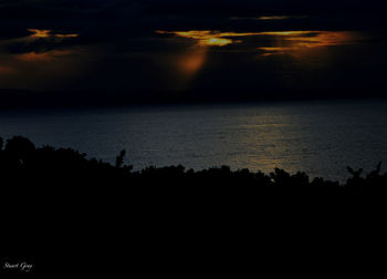 Scenic view of sea against sky at sunset