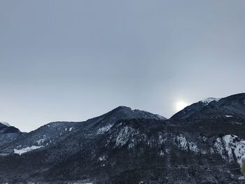 Scenic view of snowcapped mountains against clear sky