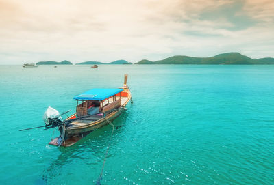Boat in sea against sky