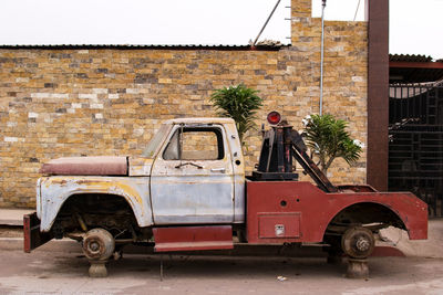 Abandoned pick-up truck outside house