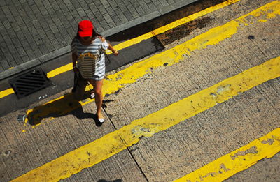 Rear view of man walking on street