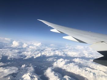 Aircraft wing flying in sky