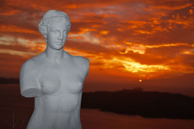 Close-up of statue against sky during sunset