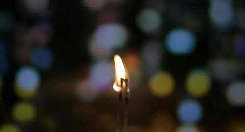 Close-up of illuminated candle