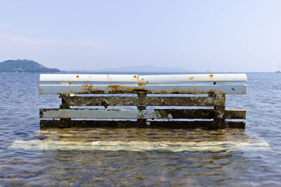 Lifeguard hut on sea against clear sky