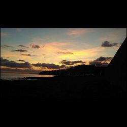 Scenic view of beach against sky during sunset