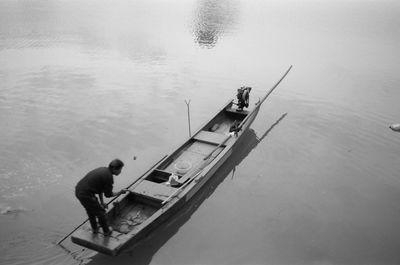 High angle view of men fishing in sea