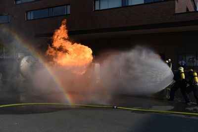 Fire hydrant against buildings in city