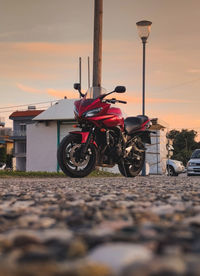 Rear view of man riding motorcycle on street