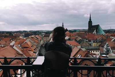 Cityscape against cloudy sky