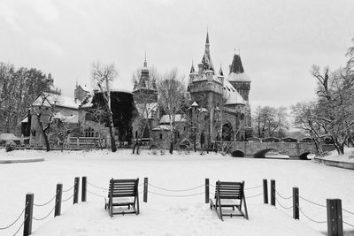 Empty benches in park during winter