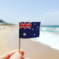 Close-up of hand holding flag