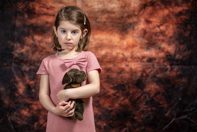 Portrait of a girl holding camera