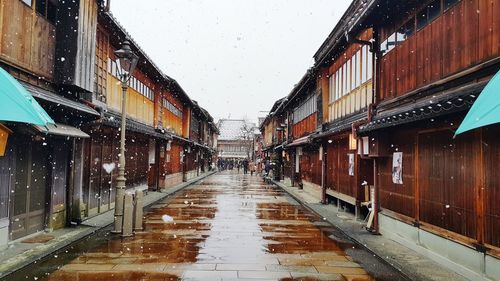 Wet alley at higashi chaya machi during snowfall