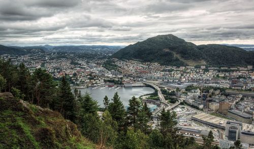 High angle view of cityscape against cloudy sky