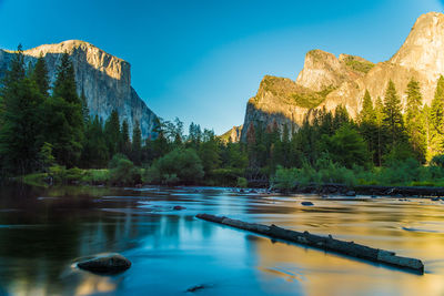 Log in lake by rocky mountains at yosemite national park