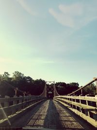 View of footbridge against sky