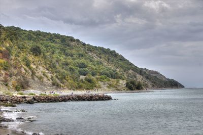 Scenic view of sea against cloudy sky