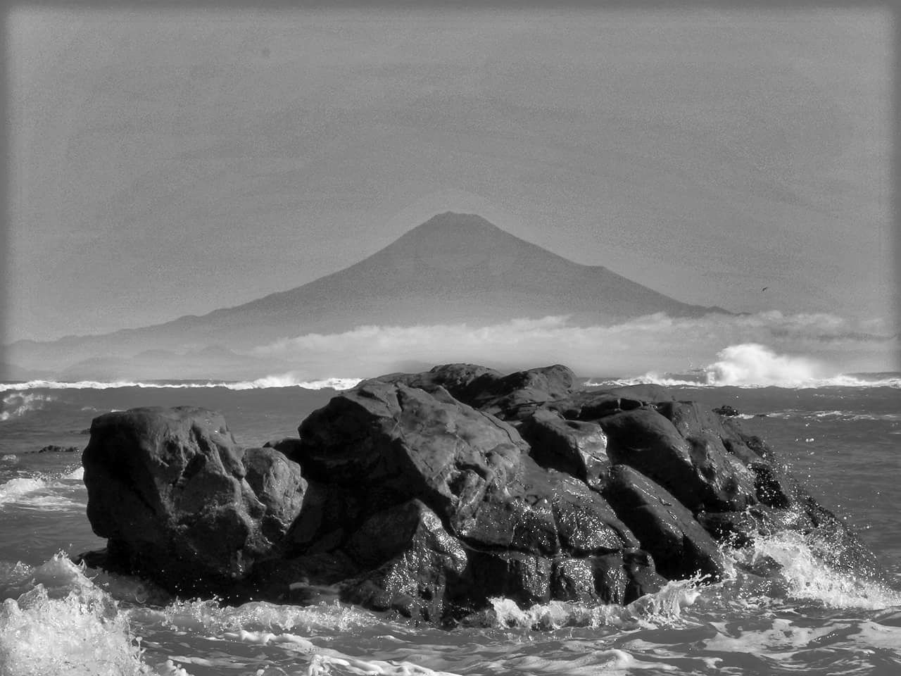 sea, beauty in nature, water, nature, rock - object, wave, scenics, rock formation, no people, waterfront, rock, sky, power in nature, outdoors, mountain, rough, day, tranquility, tranquil scene, horizon over water, motion