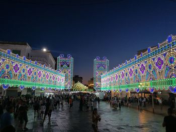 Illuminated firework display at night