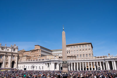 Low angle view of historical building against clear blue sky