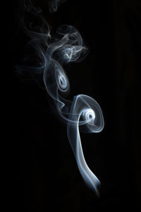 Close-up of smoke against black background