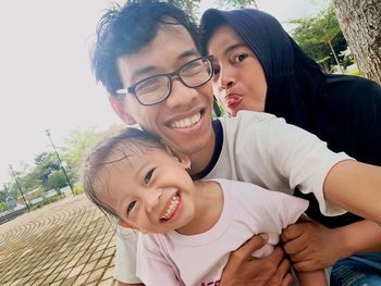 Portrait of happy family at park