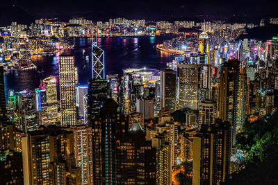 High angle view of illuminated city buildings at night