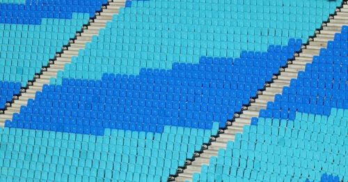 Close-up of text on tiled floor