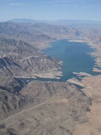 High angle view of bare mountains and lake