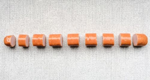 Directly above shot of sliced sausage on table